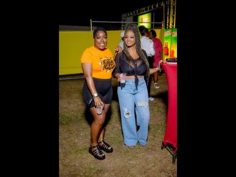 Farika Marshall (left) and Sasha Smith enjoyed a night of good mixes from the bar and the selectors at Dancehall Fashion Block