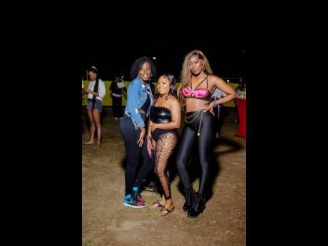 These three fashionistas (from left, Kadeem Ferguson, Shanice Bailey and Rashelle Gabbidon) enjoy the first event of Magnum Dancehall Week.